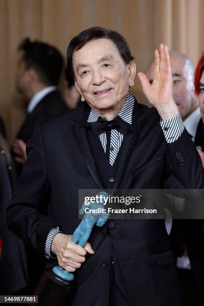 James Hong, recipient of the Outstanding Performance by a Cast in a Motion Picture award for "Everything Everywhere All at Once," poses in the press...