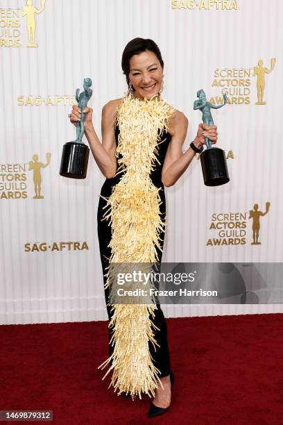 Michelle Yeoh, winner of the Outstanding Performance by a Female Actor in a Leading Role and Outstanding Performance by a Cast in a Motion Picture...