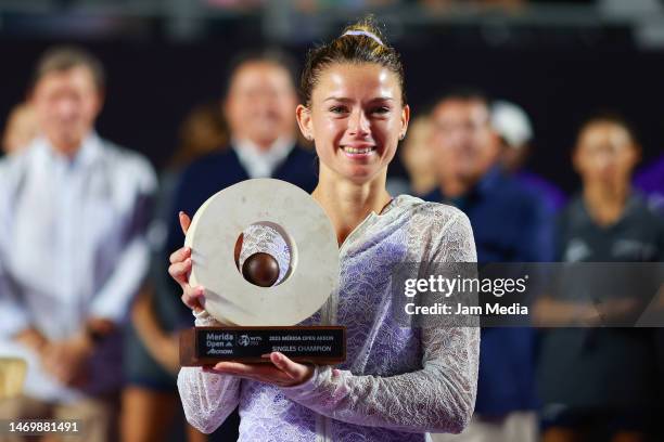 Camila Giorgi of Italy poses with the champion trophy after winning the final round singles match against Rebecca Peterson of Sweden as part of the...