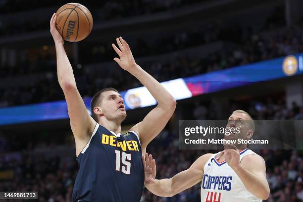 Nikola Jokic of the Denver Nuggets puts up a shot over Mason Plumlee of the Los Angeles Clippers in the first quarter at Ball Arena on February 26,...