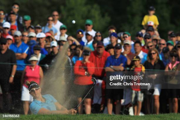 Brittany Lang watches her bunker shot on the third playoff hole against Hee Kyung Seo of South Korea following the final round of the Manulife...