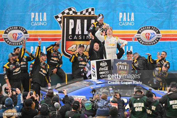 Kyle Busch, driver of the Lucas Oil Chevrolet, celebrates in victory lane after winning the NASCAR Cup Series Pala Casino 400 at Auto Club Speedway...