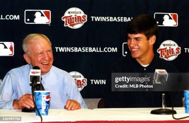 Minnesota Twins owner Carl Pohlad and first overall draft pick Joe Mauer are seen during a press conference at the Metrodome on June 6, 2001 in...