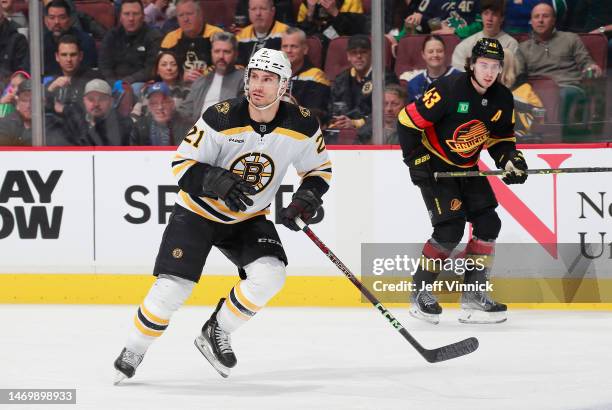 Garnet Hathaway of the Boston Bruins skates up ice during their NHL game against the Vancouver Canucks at Rogers Arena February 25, 2023 in...