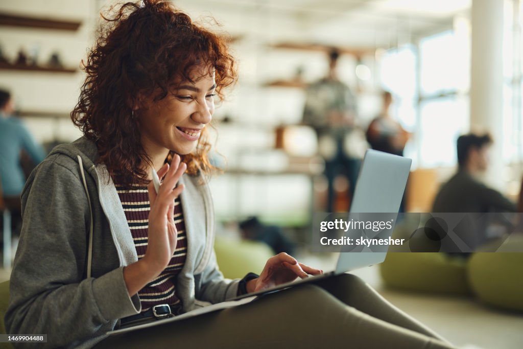 Happy black student having a video call over laptop at campus.