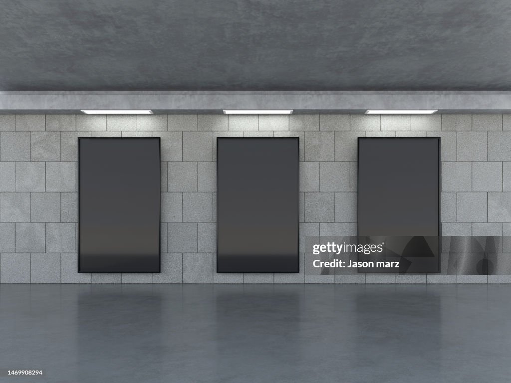 Blank billboard advertising banner media display on a subway station wall