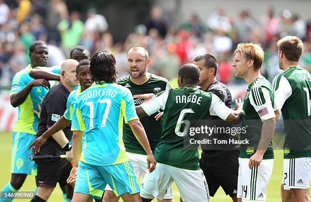 Kris Boyd of the Portland Timbers yells at Freddy Montero of the Seattle Sounders during their game on June 24, 2012 at Jeld-Wen Field in Portland,...