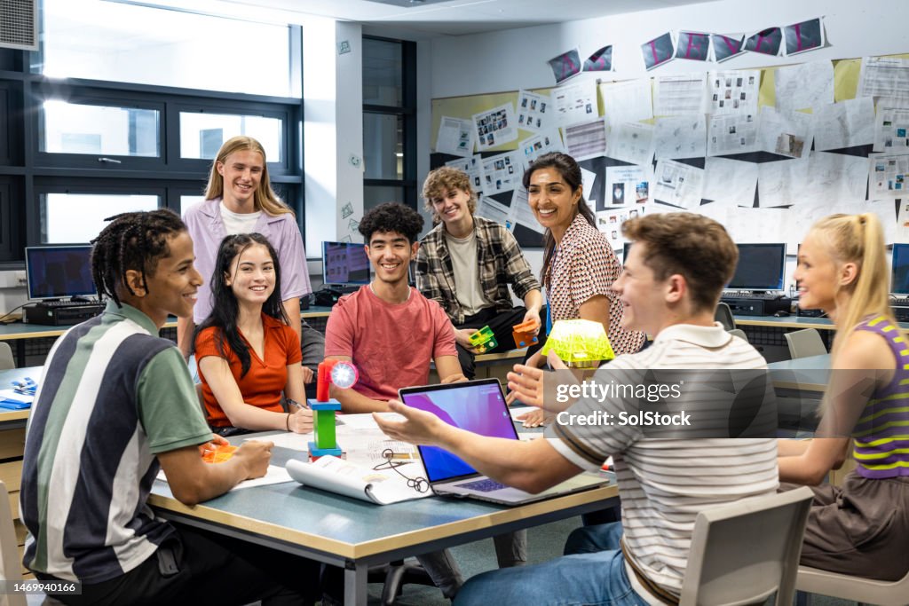 Teacher and Students Laughing in Class