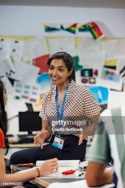 teacher guiding students - england stock pictures, royalty-free photos & images