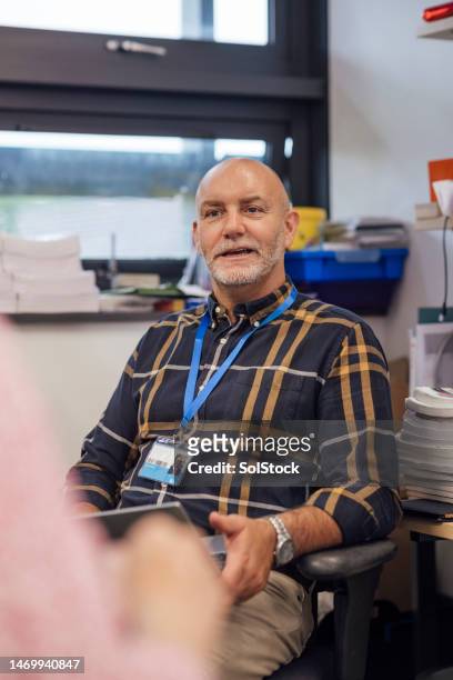 teacher leading a meeting - male teacher stock pictures, royalty-free photos & images