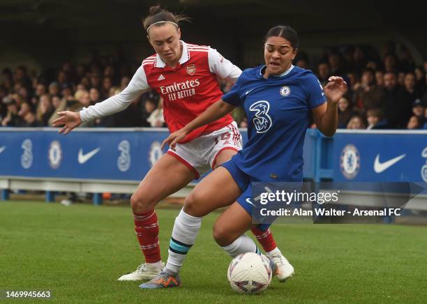 Caitlin Foord of Arsenal takes on Jess Carter of Chelsea during the WSL match between Chelsea Women and Arsenal Women at Kingsmeadow on February 26,...