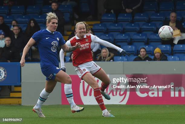 Stina Blackstenius of Arsenal shoots under pressure from Millie Bright of Chelsea during the WSL match between Chelsea Women and Arsenal Women at...