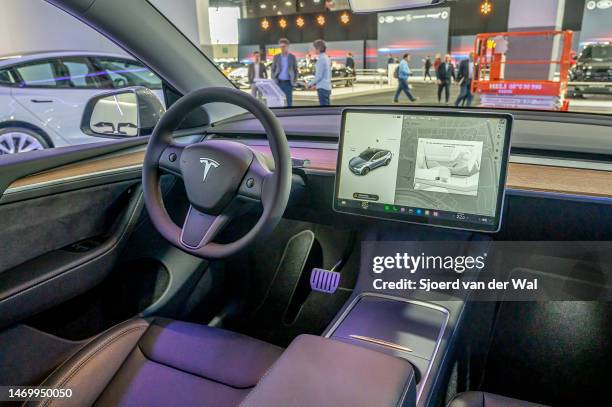 Tesla Model Y full electric crossover SUV interior with large touch sreen on the dashboard on display at Brussels Expo on January 13, 2023 in...