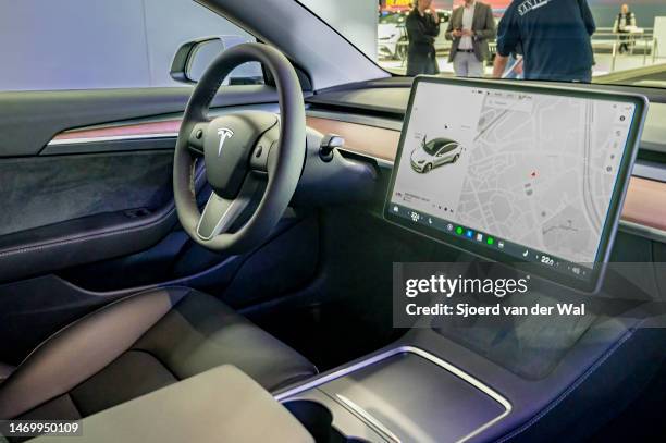 Tesla Model 3 full electric car interior with a large touch screen display on the daskboard at Brussels Expo on January 13, 2023 in Brussels, Belgium.