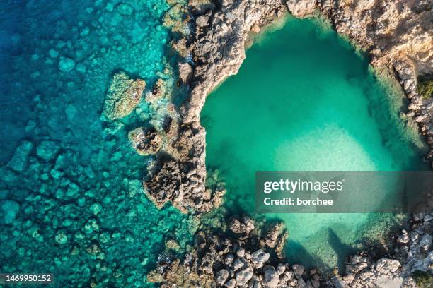 natural lake by the sea - rocky coastline stock pictures, royalty-free photos & images