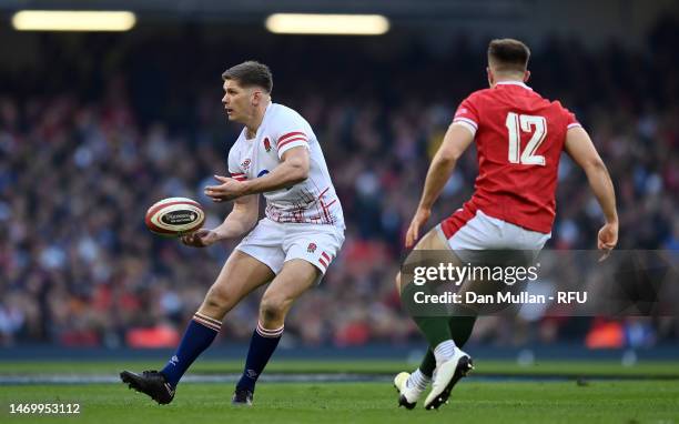 Owen Farrell of England offloads during the Six Nations Rugby match between Wales and England at Principality Stadium on February 25, 2023 in...