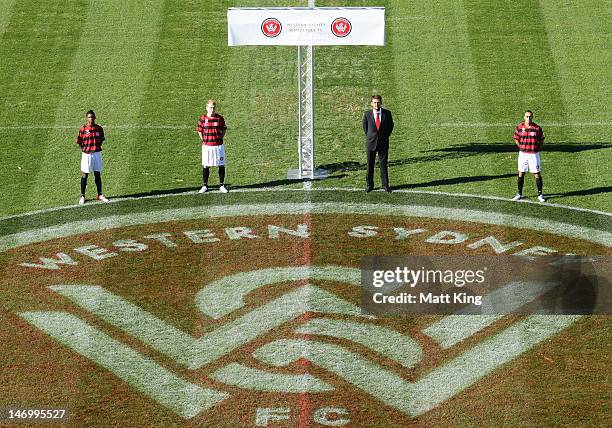 Kwabena Appiah-Kubi, Aaron Mooy, Head Coach Tony Popovic and Tarek Elrich pose in the new playing strip during the launch of the new A-League team,...