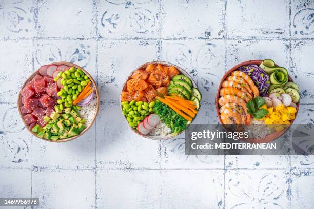 poke bowls varied, salmon poke, tuna poke and shrimp poke - shrimp edamame stock pictures, royalty-free photos & images