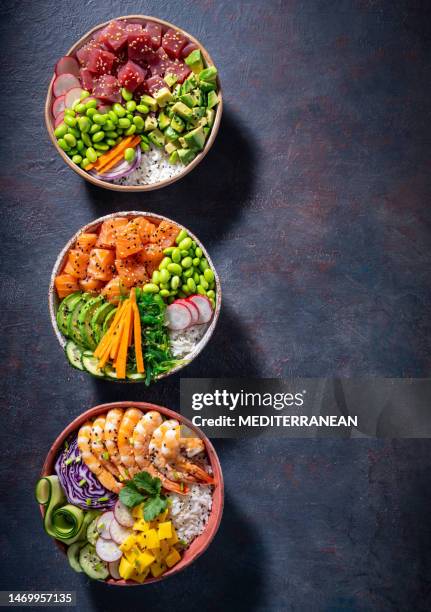 poke bowls varied, salmon poke, tuna poke and shrimp poke assorted on - shrimp edamame stock pictures, royalty-free photos & images