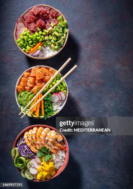 poke bowls varied, salmon poke, tuna poke and shrimp poke assorted on - shrimp edamame stock pictures, royalty-free photos & images