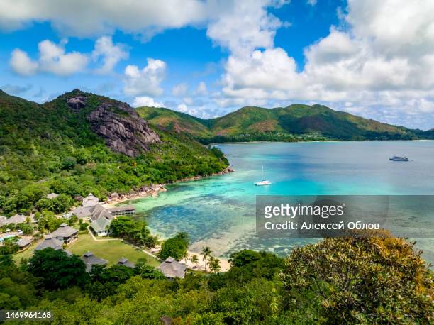 praslin seychelles tropical island with withe beaches and palm trees. aerial view of tropical paradise bay with granite stones and turquoise crystal clear waters of indian ocean - seychelles stock pictures, royalty-free photos & images