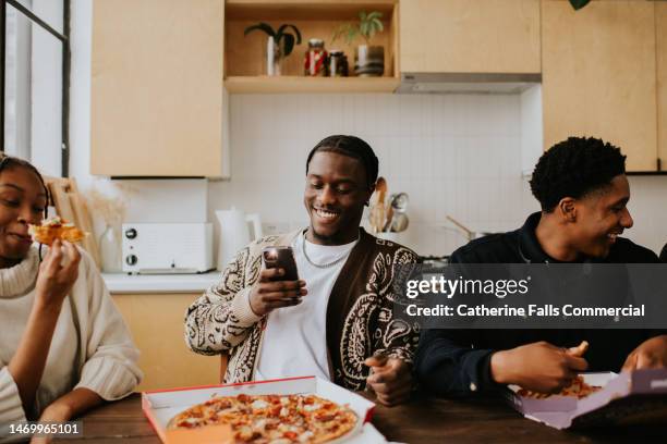 young people enjoy a delicious pizza - flash stock pictures, royalty-free photos & images