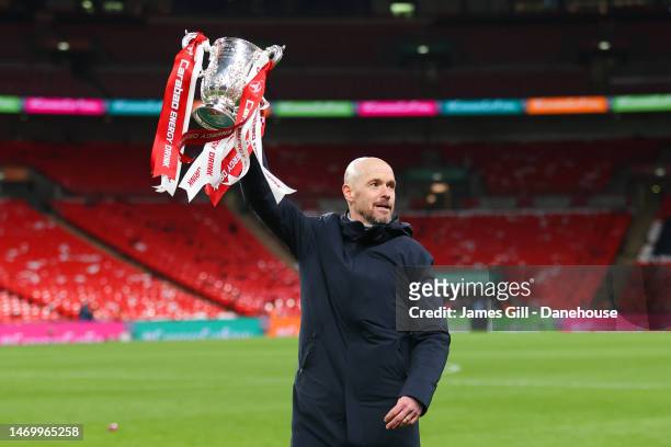 Erik ten Hag, manager of Manchester United, lifts the Carabao Cup trophy following the Carabao Cup Final match between Manchester United and...