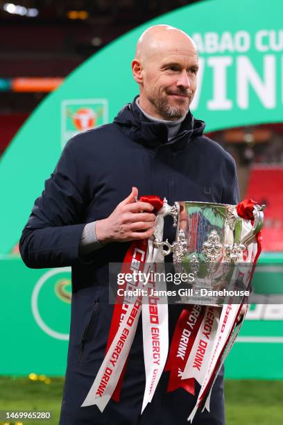 Erik ten Hag, manager of Manchester United, lifts the Carabao Cup trophy following the Carabao Cup Final match between Manchester United and...