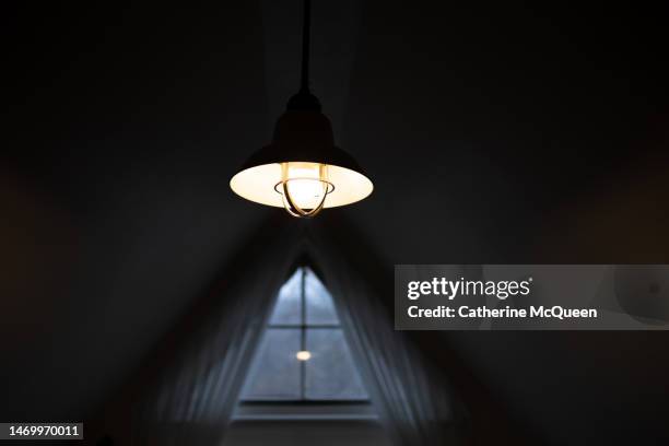 retro style statement chandelier in front of window - fitting stockfoto's en -beelden