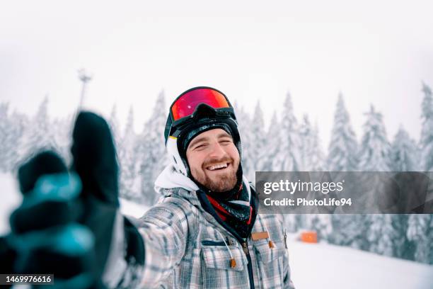 follow him for good skiing day - skier portrait stock pictures, royalty-free photos & images