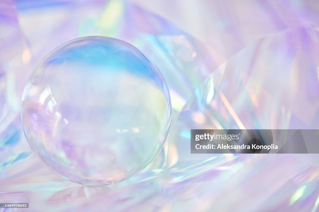 3d glass sphere, crystal ball on ethereal light pastel purple, lavender, cream, pink holographic background with copy space