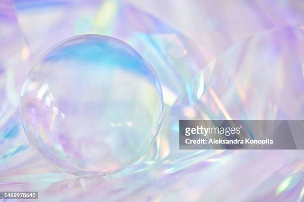 3d glass sphere, crystal ball on ethereal light pastel purple, lavender, cream, pink holographic background with copy space - クリスタル　背景 ストックフォトと画像