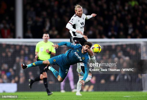 Diego Costa of Wolverhampton Wanderers is challenged by Tim Ream of Fulham FC during the Premier League match between Fulham FC and Wolverhampton...