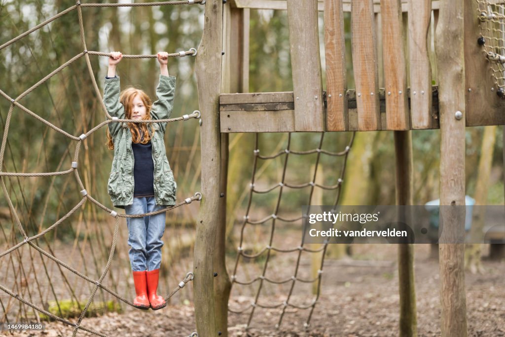 Eight-year-old on play equipment