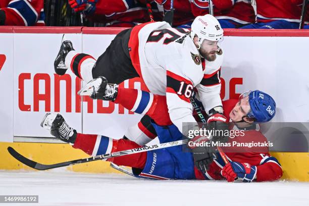 Austin Watson of the Ottawa Senators takes down Justin Barron of the Montreal Canadiens during the first period at Centre Bell on February 25, 2023...