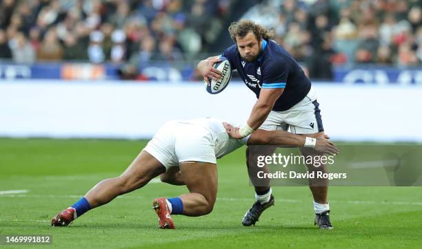 Pierre Schoeman of Scotland is tackled during the Six Nations Rugby match between France and Scotland at the Stade de France on February 26, 2023 in...