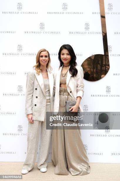 Carolina Cucinelli and Tamia Liu Tao are seen at the Brunello Cucinelli Fall-Winter 23/24 Women Collection Presentation during Milan Fashion Week on...