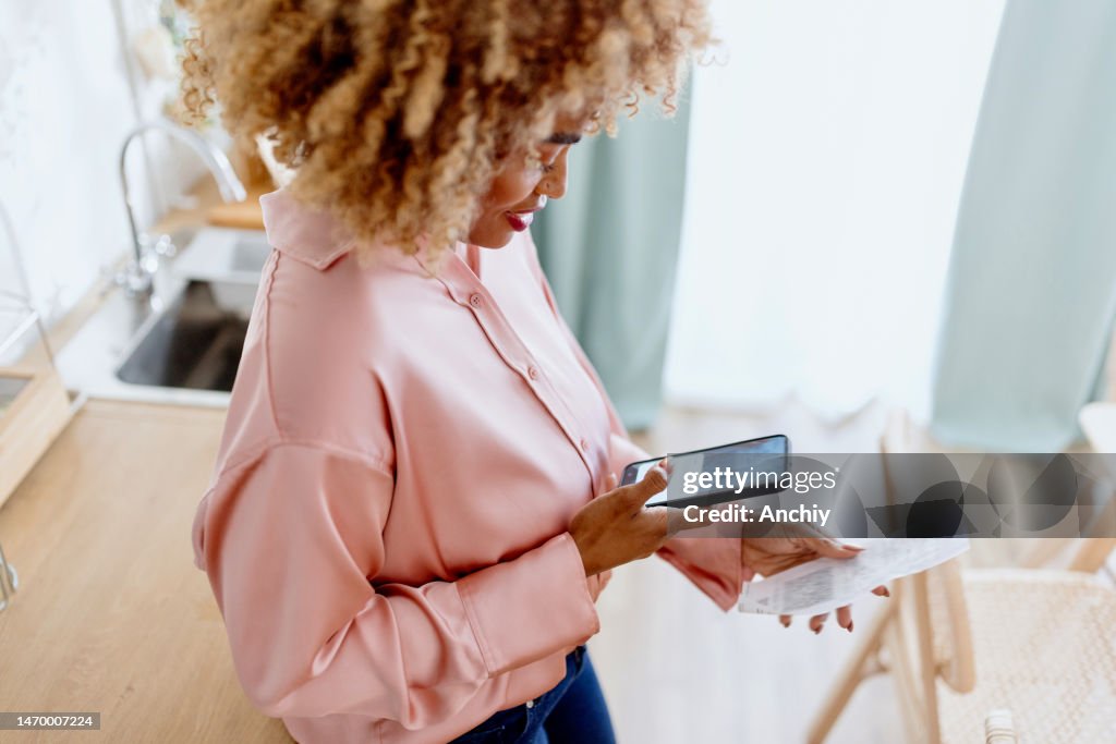 Woman scanning her bill