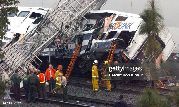 Los Angeles County Sheriff deputies, firefighters and Federal Investigators on scene of train crash between a Metrolink communter train and a...