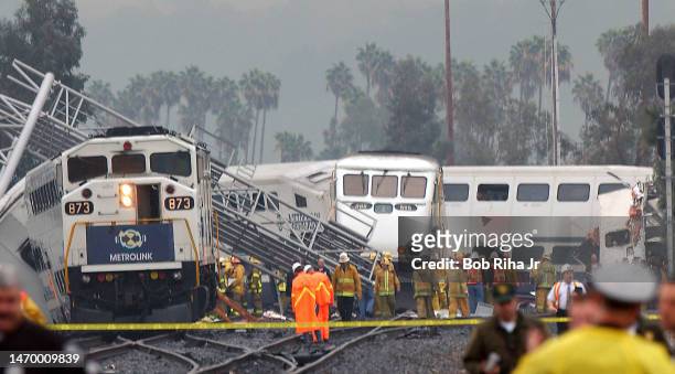 Los Angeles County Sheriff deputies, firefighters and Federal Investigators on scene of train crash between a Metrolink communter train and a...