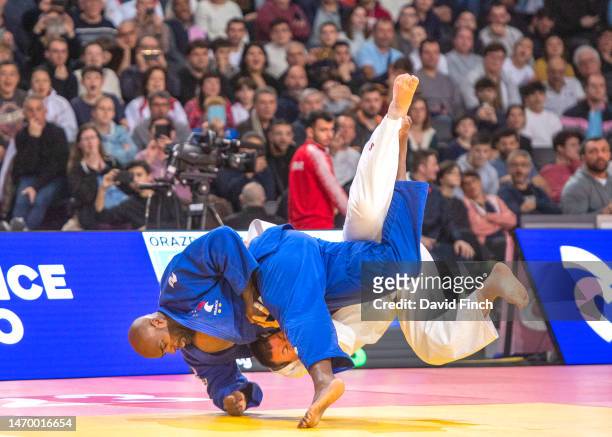Olympic and World champion, Teddy Riner of France throws Adil Orazbayev of Kazakhstan with an inner-thigh throw to score an ippon on his way to the...