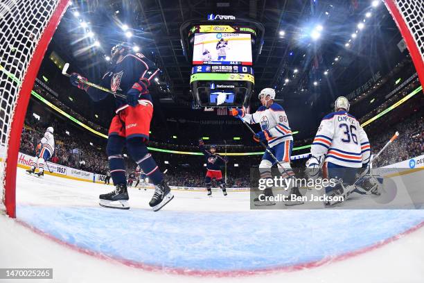 Boone Jenner of the Columbus Blue Jackets reacts after Kirill Marchenko of the Columbus Blue Jackets scores a goal on goaltender Jack Campbell of the...