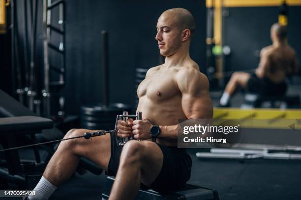 man training in gym - bald man stock pictures, royalty-free photos & images