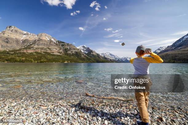 Boy Throwing Rocks Kids Throwing Stones Photos and Premium High Res Pictures - Getty Images