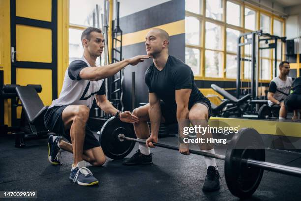 weightlifting practice in gym - spotting bildbanksfoton och bilder