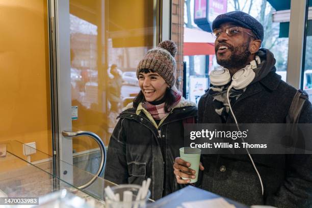 smiling students ordering pizza on lunchbreak - demanding stock pictures, royalty-free photos & images