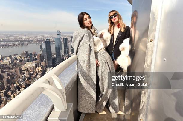 Camila Morrone and Suki Waterhouse attend as the cast of Daisy Jones & The Six visits The Empire State Building ahead of its upcoming premiere at The...