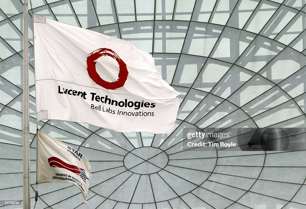 A Lucent Technologies flag flies in front of its Bell Labs... News