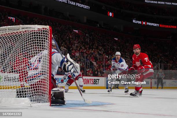 Dylan Larkin of the Detroit Red Wings and Chris Kreider of the New York Rangers watch the puck on a blocker save by Jaroslav Halak during the second...