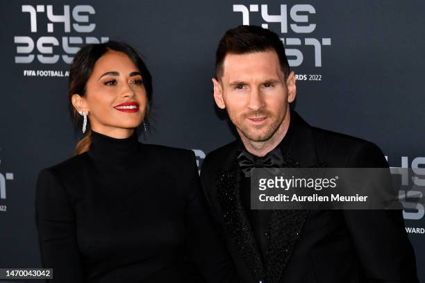 Antonela Roccuzzo and Lionel Messi pose for a photo on the Green Carpet ahead of The Best FIFA Football Awards 2022 on February 27, 2023 in Paris,...